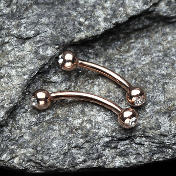Detail View 1 of Rose Gold Gem Ball Curved Barbell Eyebrow Ring-Clear Gem